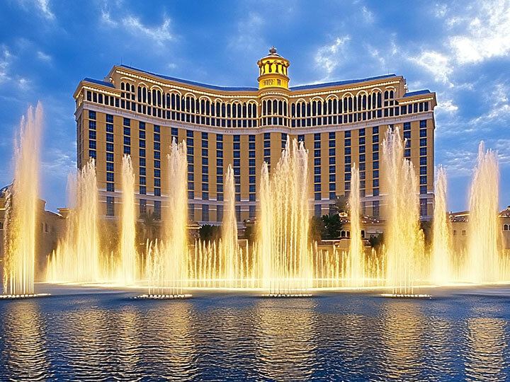 Bellagio fountains performing a water show with the hotel and casino in the background