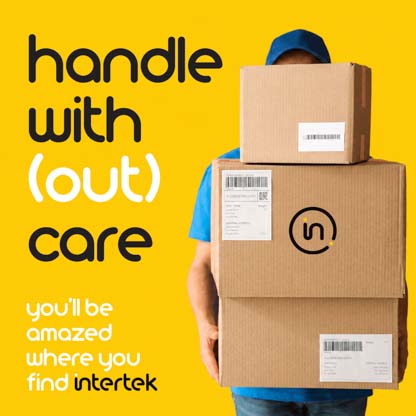Stacked cardboard boxes held by a delivery person.