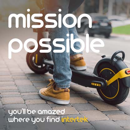 A person with one foot on an electric scooter