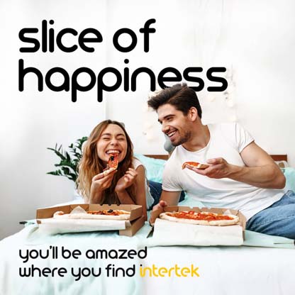 A man and woman eating pizza in bed