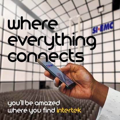 A smartphone being held in a large room with a SIEMC logo in the background